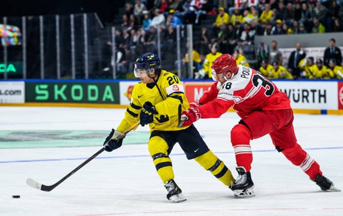 260517 AndrÃ Petersson of Sweden and Morten Poulsen of Denmark during the 2026 IIHF Ice Hockey World Championship match between Denmark and Sweden on May 17, 2026 in Fribourg Photo Jesper Zerman BILDBYRAN kod JZ JZ0716 ishockey ice hockey ishockey vm 2026 vm 2026 iihf world championship denmark sverige sweden bbeng  Copyright: JESPERxZERMAN BB260517JZ066
