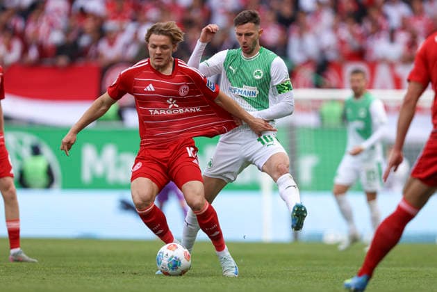 Christian Rasmussen Fortuna Düsseldorf and Branimir Hrgota SpVgg Greuther Fürth battle for the ball during the 2 Bundesliga match between SpVgg Greuther Fürth and Fortuna Düsseldorf, Sportpark Ronhof Thomas Sommer on May 17, 2026 in Fürth, Germany Photo by Oliver Kaelke DeFodi Images Christian Rasmussen Fortuna Düsseldorf and Branimir Hrgota SpVgg Greuther Fürth battle for the ball during the 2 Bundesliga match between SpVgg Greuther Fürth and Fortuna Düsseldorf at Sportpark Ronhof Thomas Sommer on May 17, 2026 in Fürth, Germany Photo by Oliver Kaelke DeFodi Images Photo by Oliver Kaelke DeFodi Images