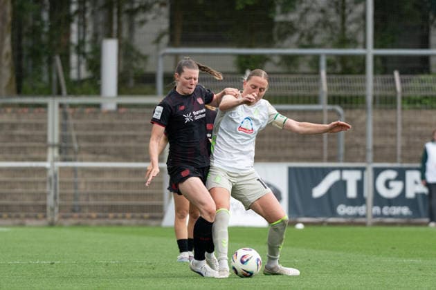 LEVERKUSEN, GERMANY - MAY 17: Claudia Wenger (5 Bayer 04 Leverkusen) and Lina Hausicke (18 SV Werder Bremen) in action during the Google Pixel Frauen-Bundesliga match between Bayer 04 Leverkusen and SV Werder Bremen at Ulrich-Haberland-Stadion on May 17, 2026 in Leverkusen, Germany. (Photo by Qianru Zhang Press Photo) Copyright: xQianruxZhang SPPx Sportspressphoto_SPR148977