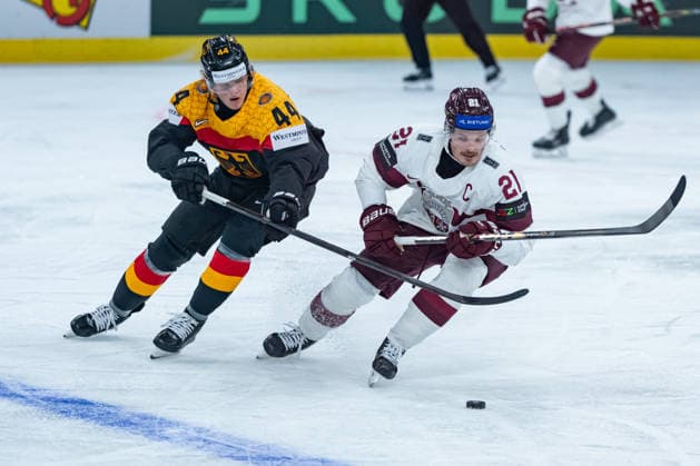 ZURICH, SWITZERLAND - MAY 17: Joshua Samanski (Germany, 44) in the battle for the puck with Rudolfs Balcers (Latvia, 21) during the Preliminary Round - Group A Match 15 between Germany and Latvia at the IIHF Ice hockey, Eishockey World Championship, WM, Weltmeisterschaft 2026, Swiss Life Arena on May 17, 2026 in Zurich, Switzerland. Zurich Switzerland Copyright: xTimoxSteinx
