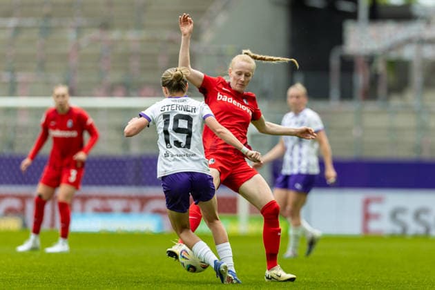 Beke Sterner SGS Essen and Meret Felde Sport Club Freiburg battle for the ball during the Women s Soccer Bundesliga match between SGS Essen and Sport Club Freiburg, Stadion an der Hafenstrasse on May 17, 2026 in Essen, Germany, Germany Photo by Mario Hommes DeFodi Images Beke Sterner SGS Essen and Meret Felde Sport Club Freiburg battle for the ball during the Women s Soccer Bundesliga match between SGS Essen and Sport Club Freiburg at Stadion an der Hafenstrasse on May 17, 2026 in Essen, Germany Photo by Mario Hommes DeFodi Images DFL regulations prohibit any use of photographs as image sequences and or quasi video