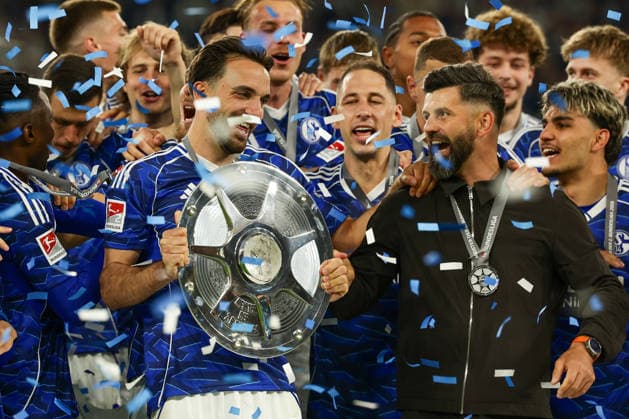 Gelsenkirchen, Germany, 17 05 26, Kenan Karaman FC Schalke 04 and Miron Muslic head coach FC Schalke 04 cheer with the trophy during the Bundesliga 2 match between FC Schalke 04 Eintracht Braunschweig at the Veltins Arena in Gelsenkirchen Photo by Joachim Bywaletz DFB DFL REGULATIONS PROHIBIT ANY USE OF PHOTOGRAPHS AS IMAGE SEQUENCES AND OR QUASI VIDEO Copyright: JoachimxBywaletz xJB-Sportfoto