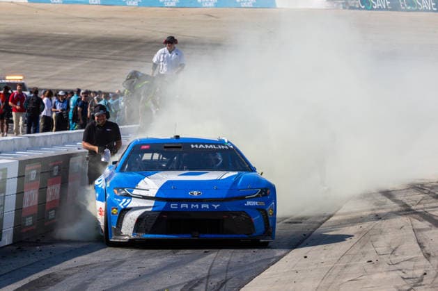 DOVER, DE - MAY 17: Denny Hamlin ( 11 Joe Gibbs Racing Progressive Insurance Toyota) celebrates with a burnout after winning the NASCAR, Motorsport, USA Cup Series All-Star Race on May 17, 2026, at Dover Motor Speedway in Dover, DE. (Photo by David Hahn Icon Sportswire) AUTO: MAY 17 NASCAR Cup Series All-Star Race EDITORIAL USE ONLY Icon260517053