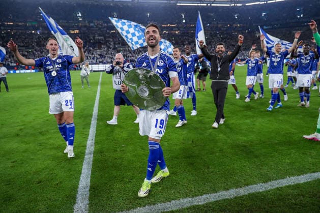 17 05 2026, Football, FC Schalke 04 Eintracht Braunschweig, 34 Matchday, 2 Bundesliga, Veltins Arena Gelsenkirchen, Season 2025 2026 Schalke 04 is champion of the 2 Bundesliga The team wins the championship and stands cheering on the pitch Joy and emotions after the victory Nikola Katic Schalke04 25 Kenan Karaman Schalke04 19 with the championship trophy Head coach Miron Muslic Schalke04 DFB regulations prohibit any use of photographs as image sequences and or quasi video North Rhine-Westphalia Germany
