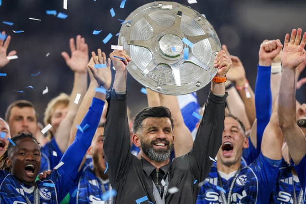 17 05 2026, Football, FC Schalke 04 Eintracht Braunschweig, 34 Matchday, 2 Bundesliga, Veltins Arena Gelsenkirchen, Season 2025 2026 Schalke 04 is champion of the 2 Bundesliga The team wins the championship and stands cheering on the pitch Joy and emotions after the victory Handover Award ceremony Head coach Miron Muslic Schalke04 with the championship trophy in his hand on the podium DFB regulations prohibit any use of photographs as image sequences and or quasi video North Rhine-Westphalia Germany