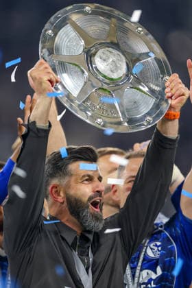 17 05 2026, Football, FC Schalke 04 Eintracht Braunschweig, 34 Matchday, 2 Bundesliga, Veltins Arena Gelsenkirchen, Season 2025 2026 Schalke 04 is champion of the 2 Bundesliga The team wins the championship and stands cheering on the pitch Joy and emotions after the victory Handover Award ceremony Head coach Miron Muslic Schalke04 with the championship trophy in his hand on the podium DFB regulations prohibit any use of photographs as image sequences and or quasi video North Rhine-Westphalia Germany