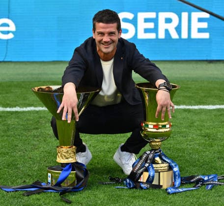 (260518) -- MILAN, May 18, 2026 -- Inter Milan s head coach Cristian Chivu poses with the trophies of Italian Cup and Serie A after the Serie A football match between Inter Milan and Hellas Verona in Milan, Italy, May 17, 2026. (Photo by Xinhua) (SP)ITALY-MILAN-FOOTBALL-SERIE A-INTER MILAN VS HELLAS VERONA AugustoxCasasoli 