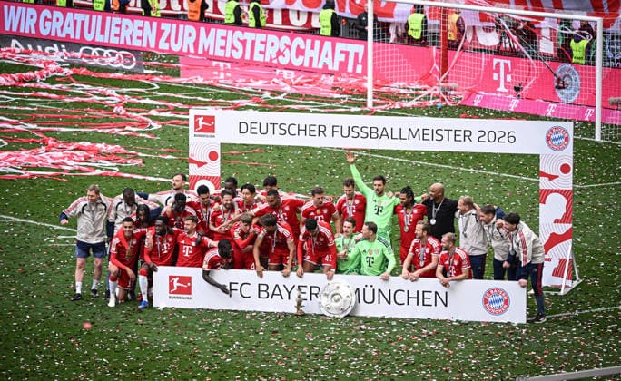 Soccer 1 Bundesliga Season 2025 2026 34 Matchday FC Bayern Muenchen 1 FC Koeln 16 05 2026 The FC Bayern team celebrates winning the 35 German championship, team picture, the sponsor Telekom congratulates on the advertising banner Goalkeeper coach Michael Rechner, co-coach Floribert N Galula, Michael Olise, co-coach Rene Maric, Bara Sapoko Ndiaye, Luis Diaz, Raphael Guerreiro, Nicolas Jackson, Hiroki Ito, Min Jae Kim, Jonathan Tah, Leon Goretzka, Josip Stanisic, goalkeeper Sven Ulreich, Serge Gnabry, coach Vincent Kompany, co-coach Aaron Danks, co-coach Walter Gfrerer, co-coach Daniel Fradley back from left Jamal Musiala, Alphonso Davies, Joshua Kimmich, Dayot Upamecano, Lennart Karl, Tom Bischof, Aleksandar Pavlovic, goalkeeper Jonas Urbig, goalkeeper Manuel Neuer, Harry Kane and Konrad Laimer front from left , with championship trophy