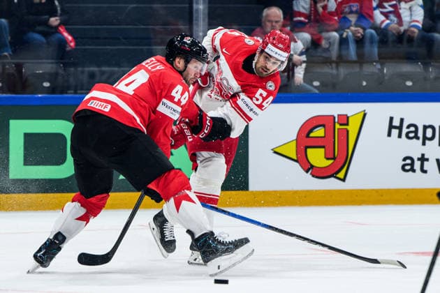 260518 Morgan Rielly of Canada and Felix Scheel of Denmark during the 2026 IIHF Ice Hockey World Championship match between Canada and Denmark on May 18, 2026 in Fribourg Photo Jesper Zerman BILDBYRAN kod JZ JZ0718 ishockey ice hockey ishockey vm 2026 vm 2026 iihf world championship kanada canada danmark denmark canada kanada bbeng danmark denmark  Copyright: JESPERxZERMAN BB260518JZ080