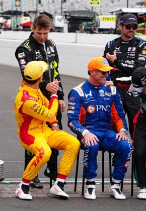 INDIANAPOLIS, IN - MAY 18: IndyCar, Indy Car, IRL, USA driver Alex Palou sitting in yellow driver suit talks to driver Will Power before a group driver photo is taken before practice for the 110th Running of the Indianapolis 500 on May 18th, 2026, at the Indianapolis Motor Speedway in Indianapolis, Indiana. (Photo by Brian Spurlock Icon Sportswire) AUTO: MAY 18 NTT IndyCar Series Indianapolis 500 Practice EDITORIAL USE ONLY Icon2605185008