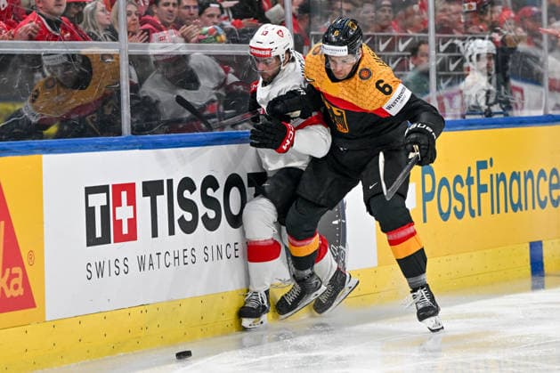 ZURICH, SWITZERLAND MAY 18 Nico Hischier of Switzerland and Kai Wissmann of Germany in a battle along the boards during the 2026 IIHF Ice Hockey World Championship Switzerland game between Germany and Switzerland at Swiss Life Arena on May 18, 2026 in Zurich, Zurich Zurich Swiss Life Arena Zurich Switzerland Switzerland Copyright: xJustPictures.ch AndreaxBrancax jp-en-EuSpIm-JP7_ANB_Ger_Sui_18052026_0540