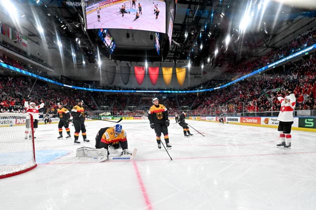 ZURICH, SWITZERLAND MAY 18 Denis Malgin of Switzerland R celebrates after scoring a goal against goalkeeper Jonas Stettmer of Germany L during the 2026 IIHF Ice Hockey World Championship Switzerland game between Germany and Switzerland at Swiss Life Arena on May 18, 2026 in Zurich, Zurich Zurich Swiss Life Arena Zurich Switzerland Copyright: xJustPictures.ch AndreaxBrancax jp-en-EuSpIm-JP7_ANB_Ger_Sui_18052026_5352