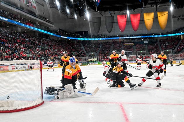 ZURICH, SWITZERLAND MAY 18 Christoph Bertschy of Switzerland R scores a goal against goalkeeper Jonas Stettmer of Germany L during the 2026 IIHF Ice Hockey World Championship Switzerland game between Germany and Switzerland at Swiss Life Arena on May 18, 2026 in Zurich, Zurich Zurich Swiss Life Arena Zurich Switzerland Copyright: xJustPictures.ch AndreaxBrancax jp-en-EuSpIm-JP7_ANB_Ger_Sui_18052026_5511