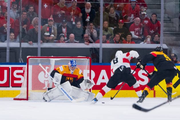 ZURICH, SWITZERLAND - MAY 18: Simon Knak (Switzerland, 8) fighting against Leon Gawanke (Germany, 9) in front of Jonas Stettmer (Germany, 1) during the Preliminary Round - Group A Match 19 between Germany and Switzerland at the IIHF Ice hockey, Eishockey World Championship, WM, Weltmeisterschaft 2026, Swiss Life Arena on May 18, 2026 in Zurich, Switzerland. Zurich Switzerland Copyright: xTimoxSteinx