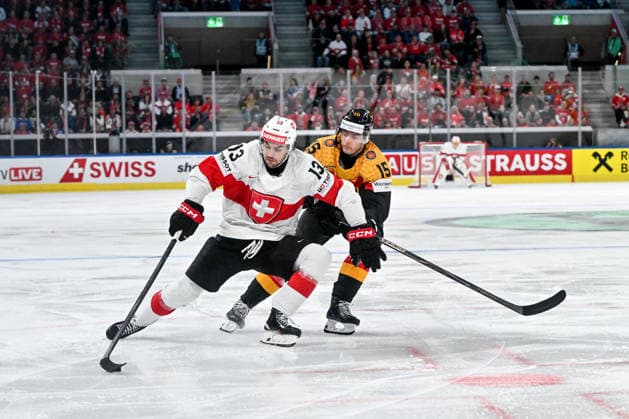 ZURICH, SWITZERLAND MAY 18 Nico Hischier of Switzerland protects the puck from Stefan Loibl of Germany during the 2026 IIHF Ice Hockey World Championship Switzerland game between Germany and Switzerland at Swiss Life Arena on May 18, 2026 in Zurich, Zurich Zurich Swiss Life Arena Zurich Switzerland Copyright: xJustPictures.ch AndreaxBrancax jp-en-EuSpIm-JP7_ANB_Ger_Sui_18052026_2232