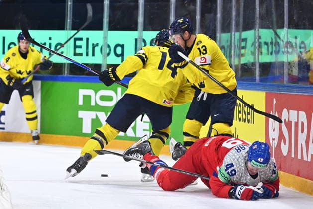 Jaroslav Chmelar of Czech Republic, right, and Lucas Raymond of Sweden (13) in action during the IIHF World Championship, WM, Weltmeisterschaft Group B match Sweden vs Czech Republic on May 18, 2026, Fribourg, Switzerland. (CTKxPhoto RadekxPetrasek) CTKPhotoP2026051808626  CTKPhotoP2026051808626