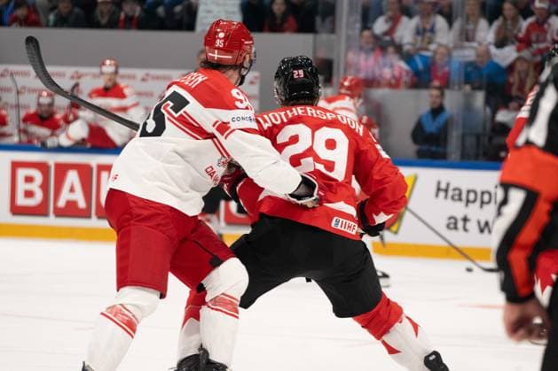 FRIBOURG, FRIBOURG - MAY 18: Nick Olesen of Denmark battles with Parker Wotherspoon of Canada during the 2026 IIHF World Championship, WM, Weltmeisterschaft Preliminary Round Group B match between Canada and Denmark at BCF Arena on May 18, 2026 in Fribourg, Fribourg, Switzerland. Copyright: xLivioxBaeriswylx xSPPx Sportspressphoto_SPR149857