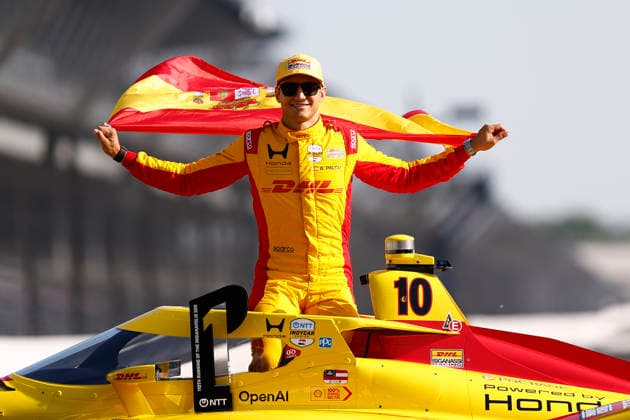 INDIANAPOLIS, IN - MAY 18: Pole sitter Alex Palou (10) Chip Ganassi Racing Honda with his country™s Spain flag and his P1 Trophy during the NTT IndyCar, Indy Car, IRL, USA Series Indianapolis 500 front row photoshoot at Indianapolis Motor Speedway in Indianapolis, IN. (Photo by Jeffrey Brown Icon Sportswire) AUTO: MAY 18 NTT IndyCar Series Indianapolis 500 Practice EDITORIAL USE ONLY Icon05126041