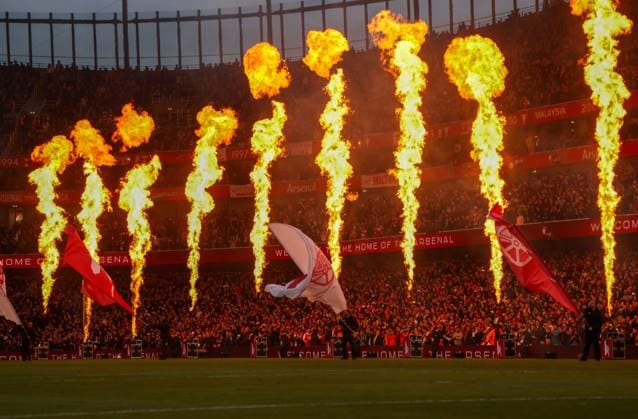 Flames going off by the side of the pitch and flags waved as the teams take to the pitch Arsenal v Burnley, Football, Premier League, Emirates Stadium, Islington, London, UK - 18 05 2026 EDITORIAL USE ONLY No use with unauthorised audio, video, data, fixture lists, club league logos or live services. Online in-match use limited to 120 images, no video emulation. No use in betting, games or single club league player publications. Copyright: xMattxImpey Shutterstockx 16882378am