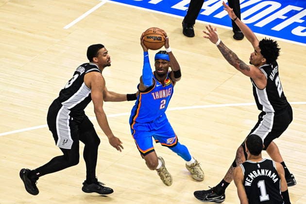 NBA, Basketball Herren, USA Western Conference Finals Game 1 - San Antonio Spurs at Oklahoma City Thunder Oklahoma City Thunder guard Shai Gilgeous-Alexander (C) drives against San Antonio Spurs forward guard Keldon Johnson (L) during game 1 of the NBA Western Conference Finals between Oklahoma City Thunder and San Antonio Spurs in Oklahoma City, Oklahoma, USA, 18 May 2026. Oklahoma City United States  Copyright: xGERALDxLEONGx