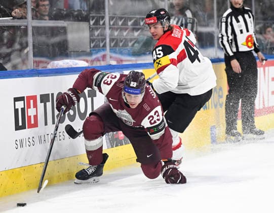 LKS 20260519 Latvia s Sandis Vilmanis (23) and Austria s Gregor Biber (R) during the 2026 IIHF Ice hockey, Eishockey World Championships preliminary round group A match between Latvia and Austria in Zurich on May 18th, 2026. - RONI REKOMAA Zürich Switzerland LxcupCXybaU  Copyright: xRonixRekomaax LxcupCXybaU