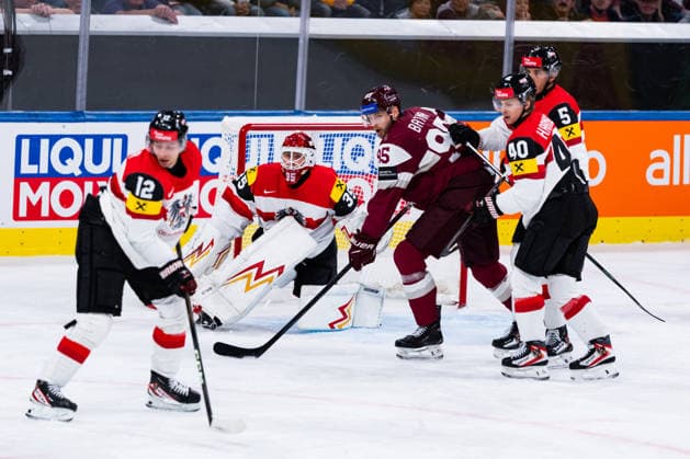 ZURICH, SWITZERLAND - MAY 19: David Maier (Austria, 12) and Atte Tolvanen (Austria, 35) against Oskars Batna (Latvia, 95) during the Preliminary Round - Group A Match 21 between Latvia and Austria at the IIHF Ice hockey, Eishockey World Championship, WM, Weltmeisterschaft 2026, Swiss Life Arena on May 19, 2026 in Zurich, Switzerland. Zurich Switzerland Copyright: xTimoxSteinx