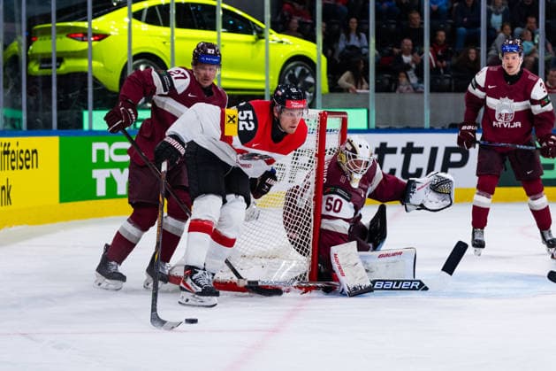 ZURICH, SWITZERLAND - MAY 19: Paul Huber (Austria, 52) at the Latvian goal during the Preliminary Round - Group A Match 21 between Latvia and Austria at the IIHF Ice hockey, Eishockey World Championship, WM, Weltmeisterschaft 2026, Swiss Life Arena on May 19, 2026 in Zurich, Switzerland. Zurich Switzerland Copyright: xTimoxSteinx