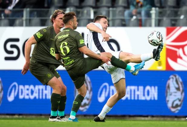 OHL s Wouter George and Charleroi s Aurelien Scheidler fight for the ball during a soccer match between Sporting Charleroi and Oud-Heverlee Leuven, Tuesday 19 May 2026 in Charleroi, on the ninth day of the Europe Play-offs (PO2) of the 2025-2026 Jupiler Pro League first division of the Belgian championship. VIRGINIExLEFOUR  x174436558x