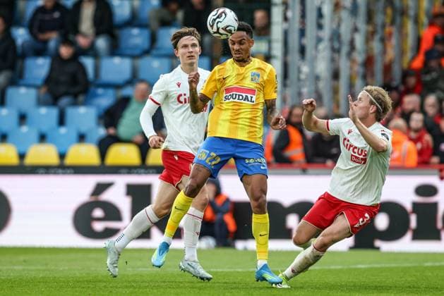 Standard s Ibe Hautekiet, Westerlo s Bryan Reynolds and Standard s Gustav Mortensen fight for the ball during a soccer match between KVC Westerlo and Standard de Liege, Tuesday 19 May 2026 in Westerlo, on the ninth day of the Europe Play-offs (PO2) of the 2025-2026 Jupiler Pro League first division of the Belgian championship. BRUNOxFAHY  x174438126x