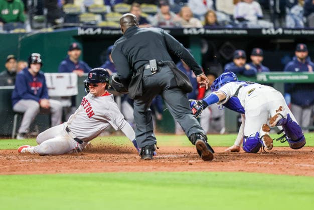 MAY 19, 2026: Kansas City Royals catcher Carter Jensen (22) tags Boston Red Sox infielder Nick Sogard (20) at the plate at Kauffman Stadium in Kansas City, MO. CSM Kansas City United States - ZUMAc04_ 20260519_zma_c04_221 Copyright: xRomanxPunox