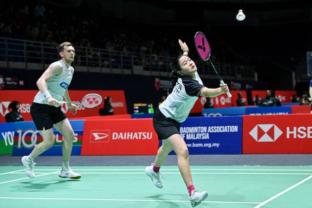 (260520) -- KUALA LUMPUR, May 20, 2026 -- Marvin Seidel Thuc Phuong Nguyen (R) of Germany compete during the mixed doubles round of 32 match between Zhu Yijun Li Qian of China and Marvin Seidel Thuc Phuong Nguyen of Germany at 2026 Malaysia Masters badminton tournament in Kuala Lumpur, Malaysia, May 20, 2026. (Photo by Xinhua) (SP)MALAYSIA-KUALA LUMPUR-BADMINTON-MALAYSIA MASTERS-MIXED DOUBLES ChongxVoonxChung 