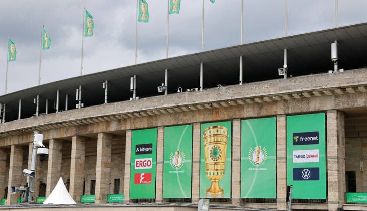 Berlin Olympic Stadium being prepared for DFB Cup final, flag branding for 2025 2026 20 05 2026 FC Bayern Munich vs VfB Stuttgart