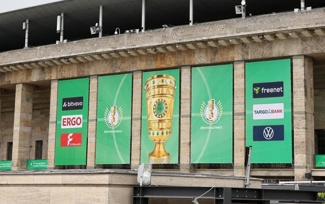 Berlin Olympic Stadium being prepared for DFB Cup final, flag branding for 2025 2026 20 05 2026 FC Bayern Munich vs VfB Stuttgart