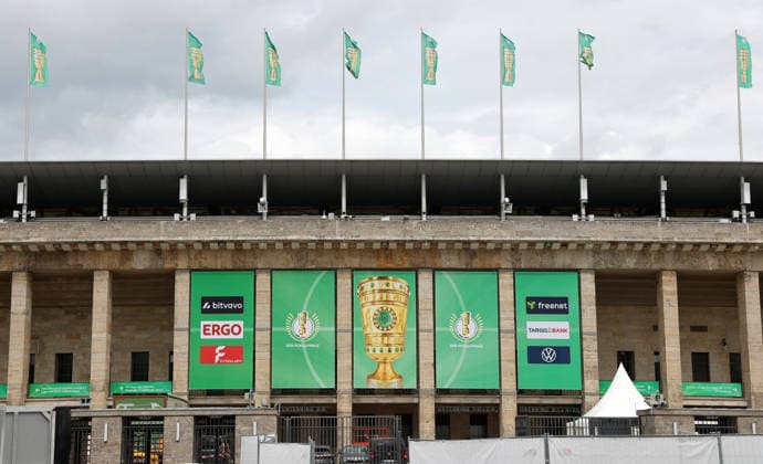 Berlin Olympic Stadium being prepared for DFB Cup final, flag branding for 2025 2026 20 05 2026 FC Bayern Munich vs VfB Stuttgart