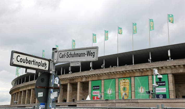 Berlin Olympic Stadium being prepared for DFB Cup final, flag branding, Coubertinplatz Carl Schumann Weg Season 2025 2026 20 05 2026 FC Bayern Munich vs VfB Stuttgart