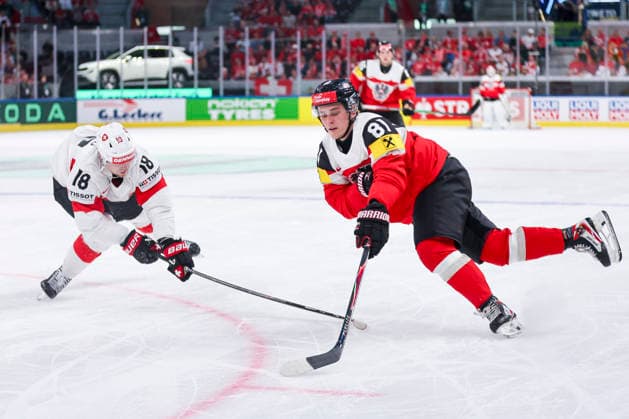 Ice hockey, Eishockey - IIHF WC 2026 ZURICH,SWITZERLAND,20.MAY.26 - ICE HOCKEY - IIHF Ice Hockey World Championship, WM, Weltmeisterschaft 2026, group stage, Austria vs Switzerland. Image shows Sven Jung (SUI) and Leon Kolarik (AUT).  GEPAxpictures xMaticxKlansek
