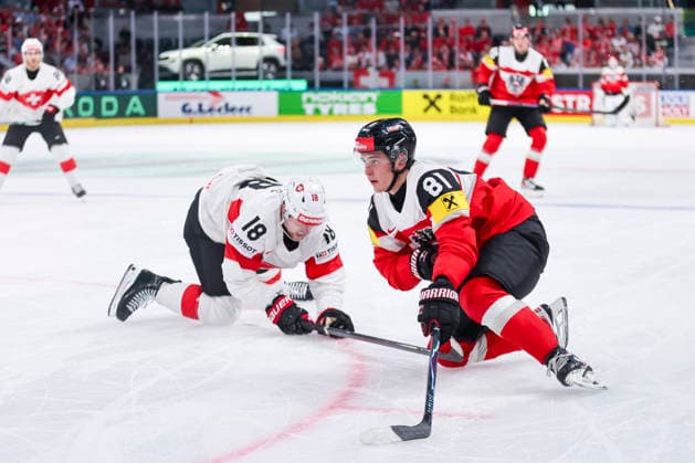 Ice hockey, Eishockey - IIHF WC 2026 ZURICH,SWITZERLAND,20.MAY.26 - ICE HOCKEY - IIHF Ice Hockey World Championship, WM, Weltmeisterschaft 2026, group stage, Austria vs Switzerland. Image shows Sven Jung (SUI) and Leon Kolarik (AUT).  GEPAxpictures xMaticxKlansek