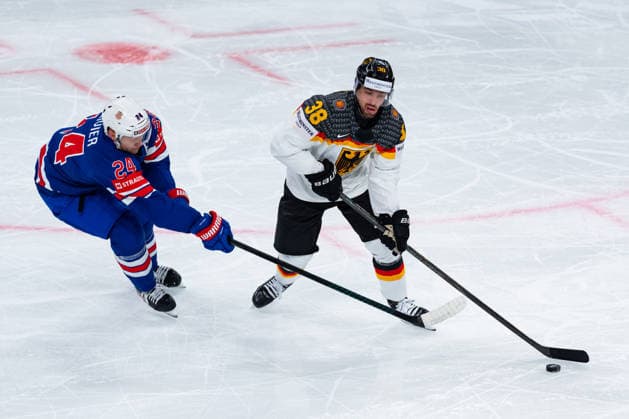 ZURICH, SWITZERLAND - MAY 20: Fabio Wagner (Germany, 38) in the battle for the puck with Oliver Mathieu (United States, 24) during the Preliminary Round - Group A Match 27 between United States and Germany at the IIHF Ice hockey, Eishockey World Championship, WM, Weltmeisterschaft 2026, Swiss Life Arena on May 20, 2026 in Zurich, Switzerland. Zurich Switzerland Copyright: xTimoxSteinx