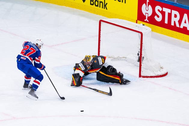 ZURICH, SWITZERLAND - MAY 20: Matt Coronato (United States, 27) in the battle for the puck with Philipp Grubauer (Germany, 30) during the Preliminary Round - Group A Match 27 between United States and Germany at the IIHF Ice hockey, Eishockey World Championship, WM, Weltmeisterschaft 2026, Swiss Life Arena on May 20, 2026 in Zurich, Switzerland. Zurich Switzerland Copyright: xTimoxSteinx