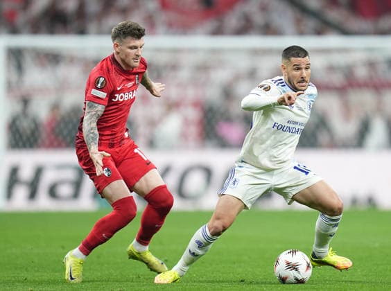 ISTANBUL, TURKEY - MAY 20: Lukas Kübler of SC Freiburg battles for the ball with Emiliano Buendia of Aston Villa during the UEFA Europa League Final 2026 match between SC Freiburg and Aston Villa FC at Besiktas Park on May 20, 2026 in Istanbul, Turkey.  Copyright: xMBxMediax