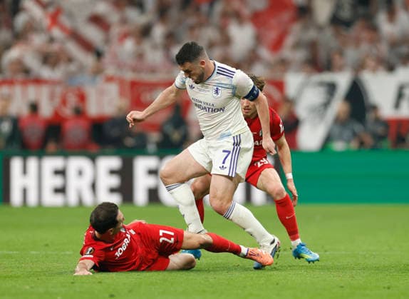 Istanbul, Turkey, 20th May 2026. Nicolas Hofler of SC Freiburg and Philipp Treu of SC Freiburg tackle John McGinn of Aston Villa during the SC Freiburg vs Aston Villa UEFA Europa League Final match at Besiktas Park, Istanbul. Picture credit should read: Cody Froggatt Sportimage EDITORIAL USE ONLY. No use with unauthorised audio, video, data, fixture lists, club league logos or live services. Online in-match use limited to 120 images, no video emulation. No use in betting, games or single club league player publications. SPI_069_CF_Frieburg_Aston_Villa SPI-4796-0099