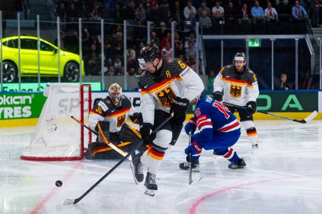 ZURICH, SWITZERLAND - MAY 20: Kai Wissmann (Germany, 6) getting the puck from Tommy Novak (United States, 15) during the Preliminary Round - Group A Match 27 between United States and Germany at the IIHF Ice hockey, Eishockey World Championship, WM, Weltmeisterschaft 2026, Swiss Life Arena on May 20, 2026 in Zurich, Switzerland. Zurich Switzerland Copyright: xTimoxSteinx