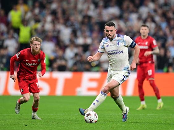 Freiburg v Aston Villa - UEFA Europa League final ISTANBUL, TURKIYE - MAY 20:John McGinn of Aston Villa competes against Niklas Beste of Freiburg during the UEFA Europa League final match between Freiburg and Aston Villa at Besiktas Park in Istanbul, Turkiye, on May 20, 2026. Oguz Yeter Anadolu Istanbul Turkey. Editorial use only. Please get in touch for any other usage.  Copyright: x2026xAnadoluxOguzxYeterx