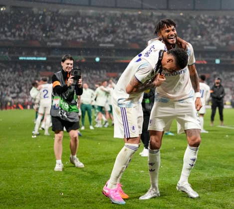 ISTANBUL, TURKEY - MAY 20: Morgan Rogers (left) and Tyrone Mings of Aston Villa celebrate after winning the UEFA Europa League Final 2026 match between SC Freiburg and Aston Villa FC at Besiktas Park on May 20, 2026 in Istanbul, Turkey.  Copyright: xMBxMediax