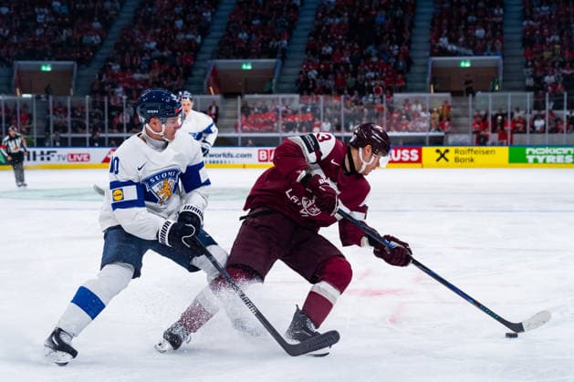 ZURICH, SWITZERLAND - MAY 21: Henri Jokiharju (Finland, 10) in the battle for the puck with Alberts Smits (Latvia, 3) during the Preliminary Round - Group A Match 29 between Latvia and Finland at the IIHF Ice hockey, Eishockey World Championship, WM, Weltmeisterschaft 2026, Swiss Life Arena on May 21, 2026 in Zurich, Switzerland. Zurich Switzerland Copyright: xTimoxSteinx