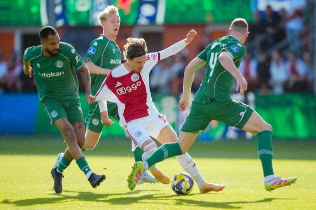 VOLENDAM , 21-05-2026 , Kras Stadium, season 2025 2026 , Play-offs for European football , Dutch Eredivisie Football . Match between Ajax and FC Groningen , picture shows FC Groningen player Marvin Peersman , Ajax player Mika Godts and FC Groningen player Dies Janse Ajax - Groningen (play off)  x203865033x Copyright:
