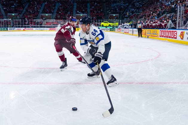 ZURICH, SWITZERLAND - MAY 21: Artus Andzans (Latvia, 5) in the battle for the puck with Mikael Granlund (Finland, 64) during the Preliminary Round - Group A Match 29 between Latvia and Finland at the IIHF Ice hockey, Eishockey World Championship, WM, Weltmeisterschaft 2026, Swiss Life Arena on May 21, 2026 in Zurich, Switzerland. Zurich Switzerland Copyright: xTimoxSteinx