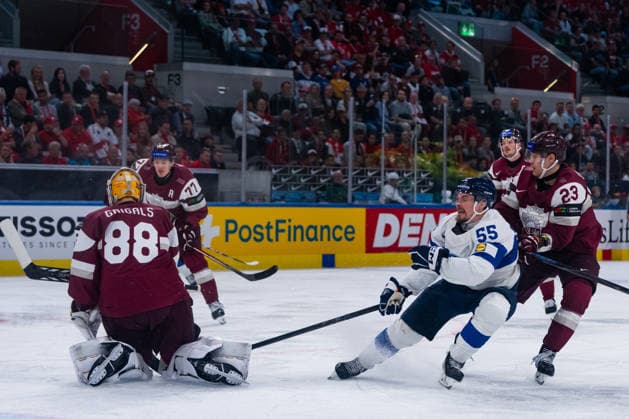 ZURICH, SWITZERLAND - MAY 21: Gustavs Grigals (Lativa, 88) and Sandis Vilmanis (Latvia, 23) stop Makael Seppaelae (Finaland, 55) during the Preliminary Round - Group A Match 29 between Latvia and Finland at the IIHF Ice hockey, Eishockey World Championship, WM, Weltmeisterschaft 2026, Swiss Life Arena on May 21, 2026 in Zurich, Switzerland. Zurich Switzerland Copyright: xTimoxSteinx