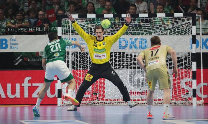 Tim Freihöfer scores a goal against goalkeeper Joel Birlehm duel Game scene Action Sport Handball HBL Bundesliga Men 32 Matchday Season 2025 2026 21 05 2026 Füchse Berlin vs TSV Hannover Burgdorf