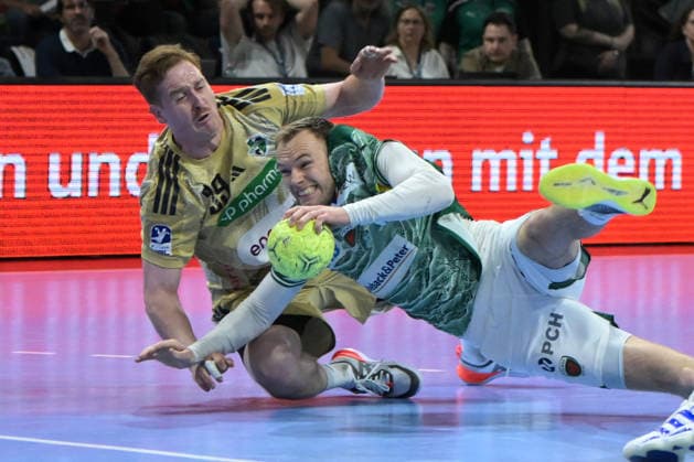 21 05 2026, xlakx, Handball Daikin HBL, Fuechse Berlin TSV Hannover Burgdorf v l Lukas Stutzke TSV Hannover Burgdorf , Mathias Gidsel Fuechse Berlin duel, duel, fight, tackle Berlin Daniel Lakomski